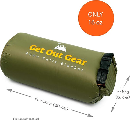 A rolled-up olive green Get Out Gear Down Puffy Blanket with black straps, measuring 12 inches by 5 inches. An orange circle highlights that it weighs only 16 oz.