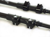 Close-up of Get Out Gear Goat Stix trekking pole flip-lock mechanisms with all-metal construction on carbon fiber shafts, showing adjustable clamps and durable build.
