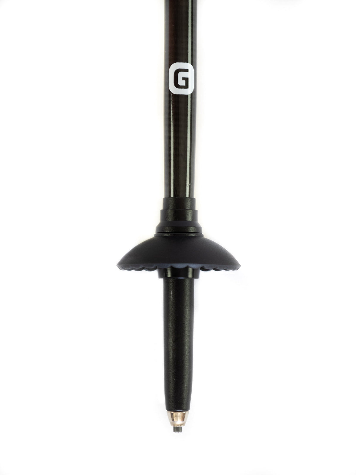 Close-up of Get Out Gear Goat Stix trekking pole tip featuring a 1.5 mm thick shaft for added durability, a tungsten carbide tip for traction, and an attachable mud basket.