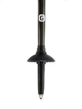 Close-up of Get Out Gear Goat Stix trekking pole tip featuring a 1.5 mm thick shaft for added durability, a tungsten carbide tip for traction, and an attachable mud basket.