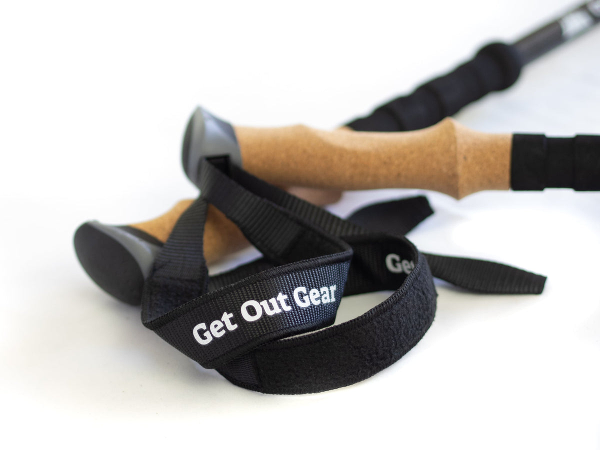 Close-up of Get Out Gear Goat Stix trekking pole handles with cork grips and wide, felt-lined wrist straps, highlighting comfort and support.